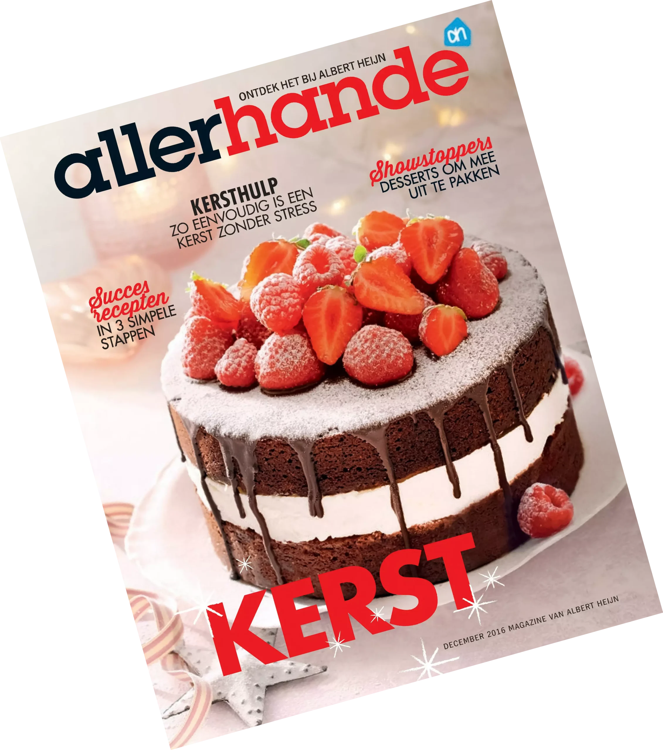ah-allerhande-december-2016 Voorpagina van de kersteditie van de Allerhande van 2016. Op de voorpagina is een desserttaartje afgebeeld met twee chocoladelagen en poedersuiker en aardbeien on top.
